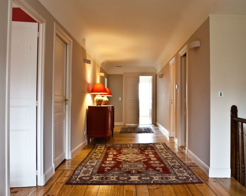 Premium bedding, desk, laptop workspace, blackout drapes