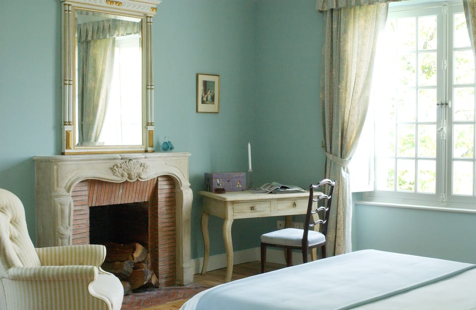 Premium bedding, desk, laptop workspace, blackout drapes