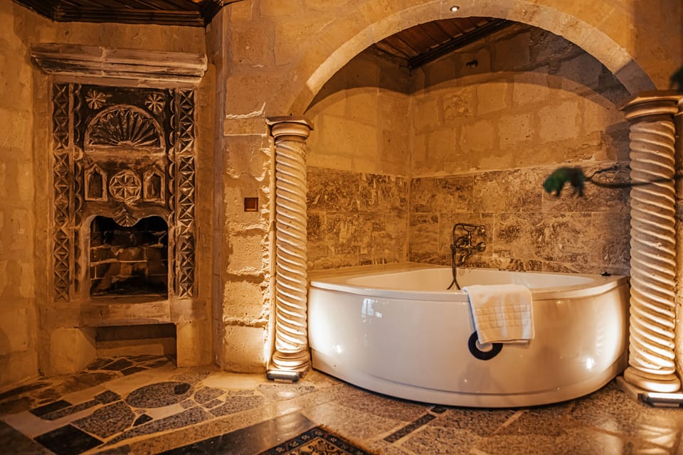 Grand Suite | Bathroom | Designer toiletries, hair dryer, slippers, towels