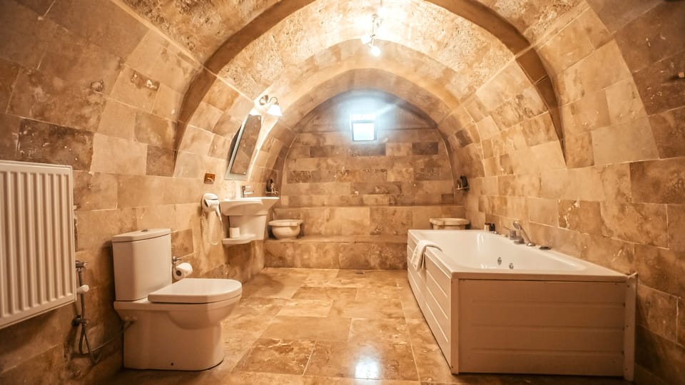 Suite, Jetted Tub (Stone) | Bathroom | Designer toiletries, hair dryer, slippers, towels