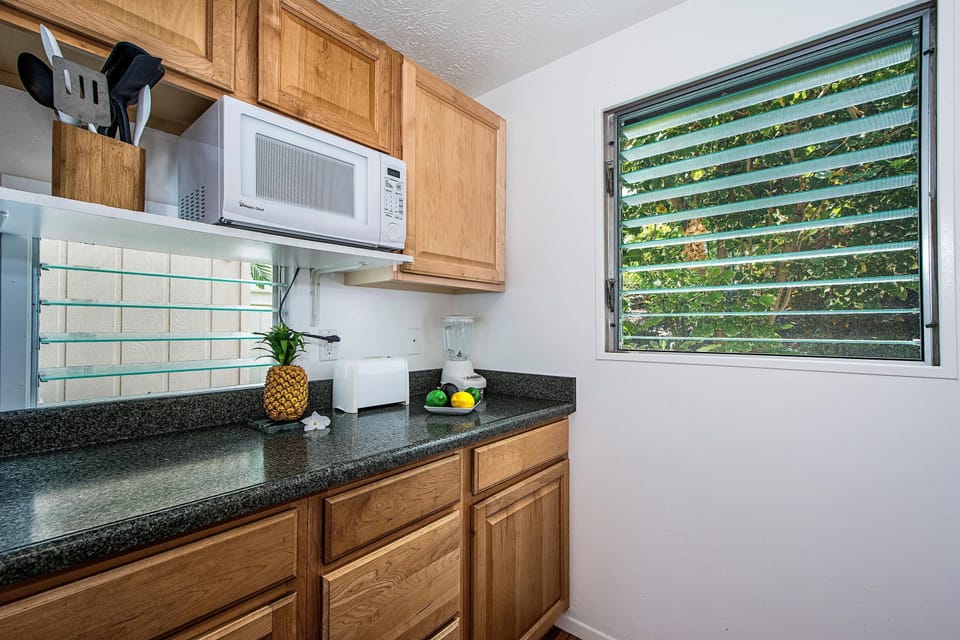 Condo, Multiple Beds, Partial Ocean View (Keauhou Kona Surf & Racquet Club #37) | Private kitchen | Full-size fridge, microwave, stovetop, dishwasher