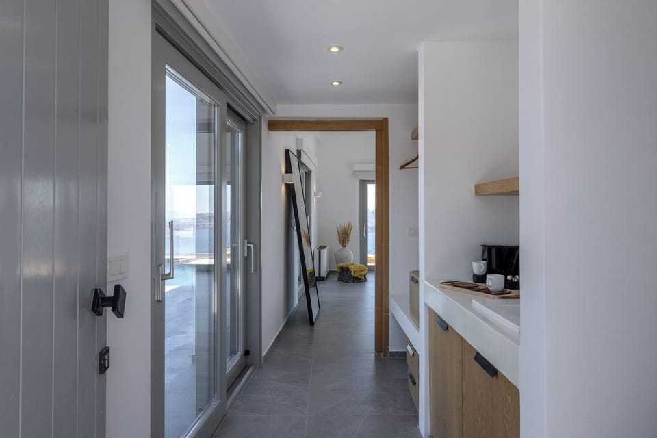 Superior Suite with Loft with Caldera View and Private Pool | Minibar, in-room safe, individually decorated, desk