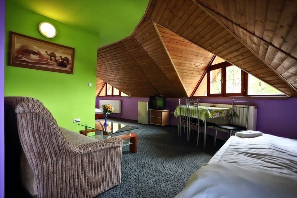 Family Room, Multiple Beds | Living area | Flat-screen TV
