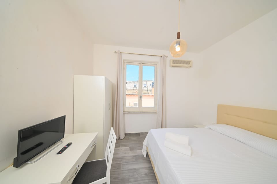 Economy Double Room | Desk, blackout drapes, cribs/infant beds, free WiFi