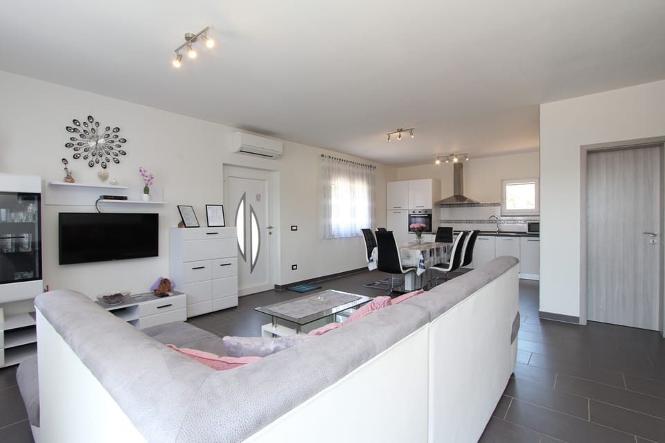 Apartment, 3 Bedrooms | Living area | Flat-screen TV
