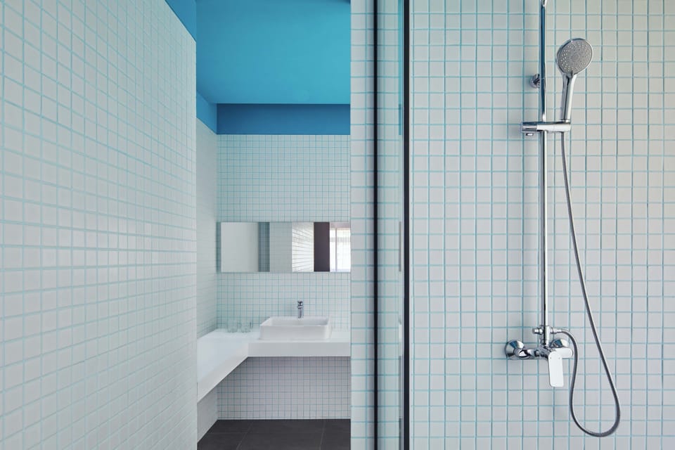 Studio 55 | Bathroom | Shower, free toiletries, slippers, towels