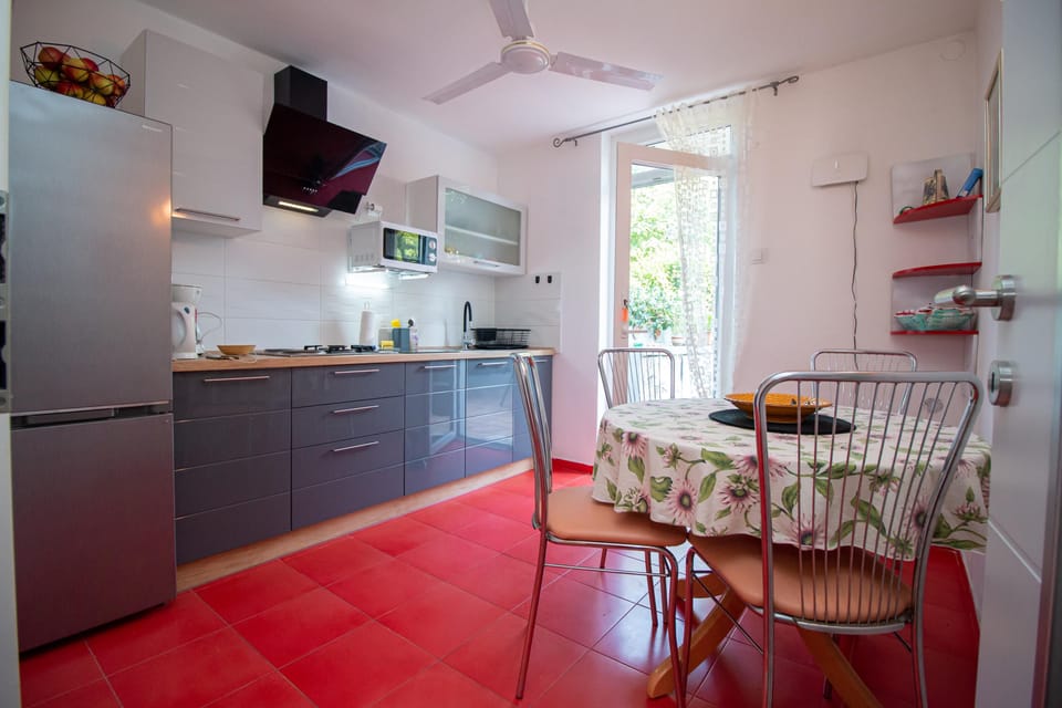 Apartment, 2 Bedrooms | Private kitchen | Fridge, microwave, stovetop, coffee/tea maker