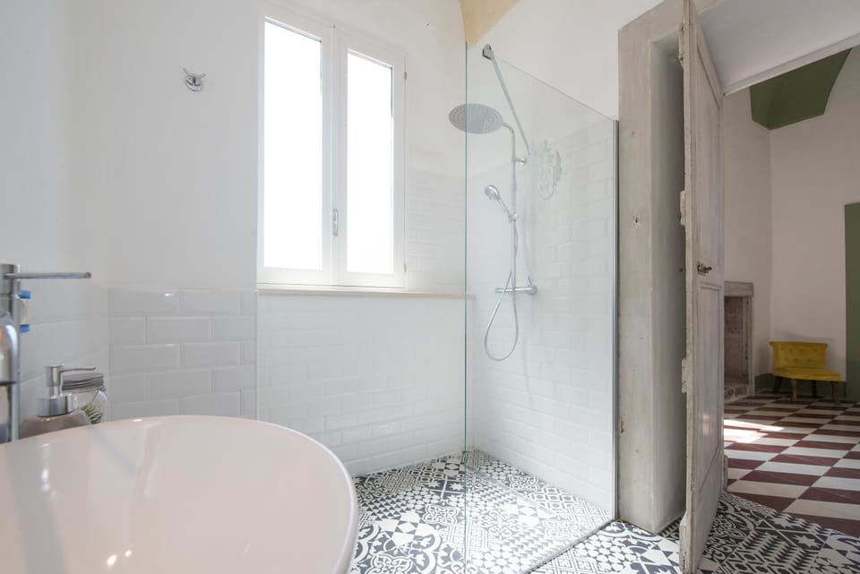 Junior Suite, City View | Bathroom | Shower, deep soaking tub, rainfall showerhead, free toiletries