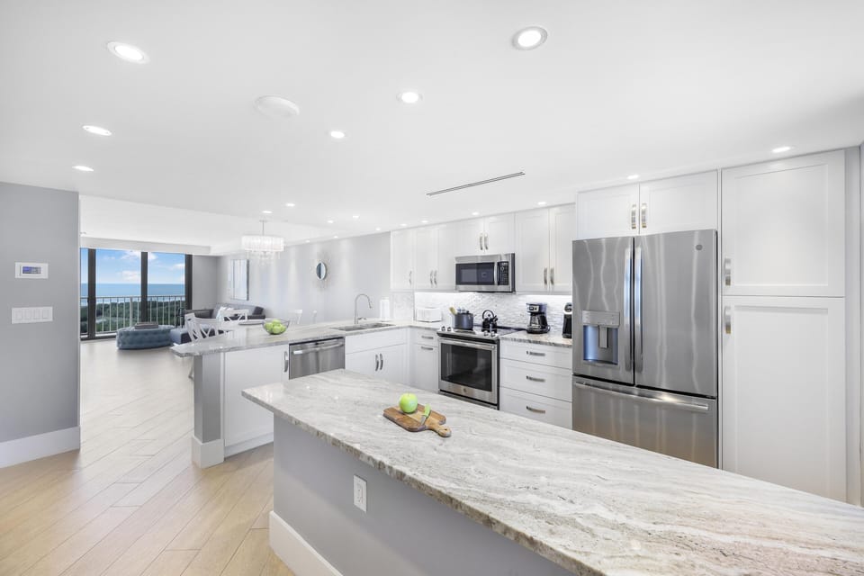 Condo, 1 King Bed with Sofa bed (Elegant beachfront condo in private c) | Private kitchen | Fridge, microwave, oven, stovetop