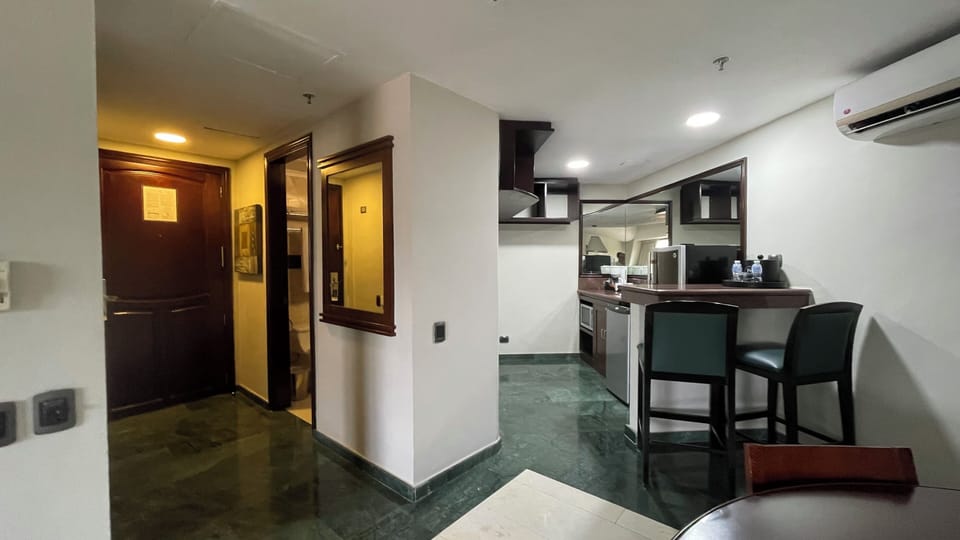 Deluxe Suite, Balcony, City View | 1 bedroom, in-room safe, desk, blackout drapes