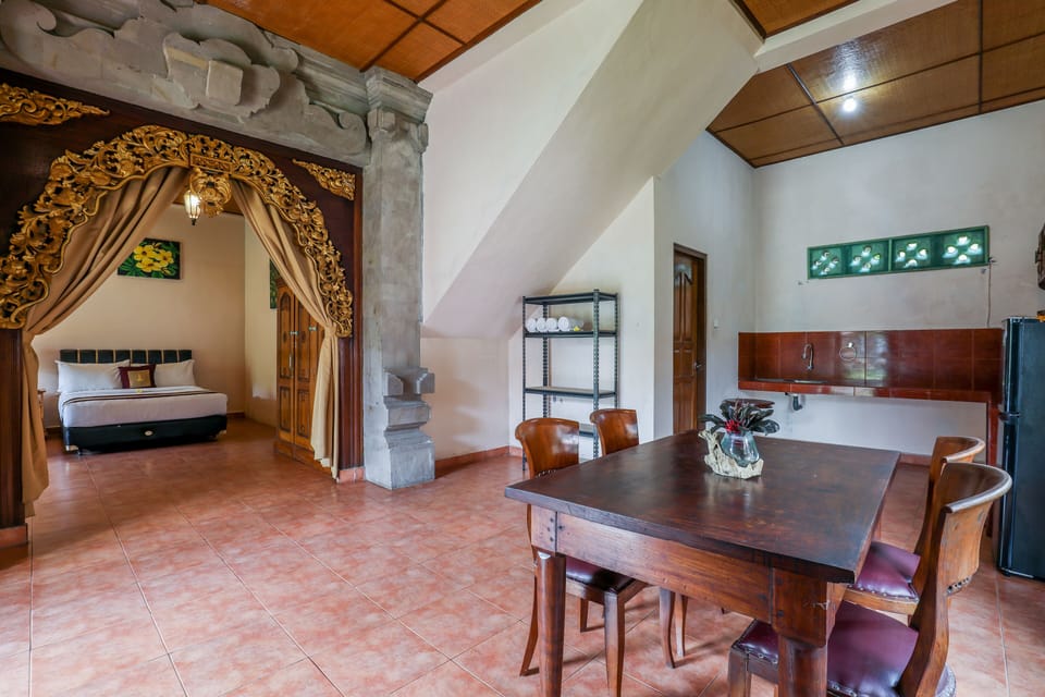 Family Room, 2 Double Beds, Balcony, Garden View | In-room dining