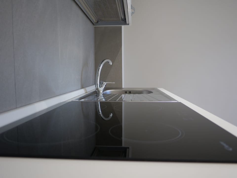 Deluxe Room | Private kitchen | Fridge, oven, cookware/dishes/utensils