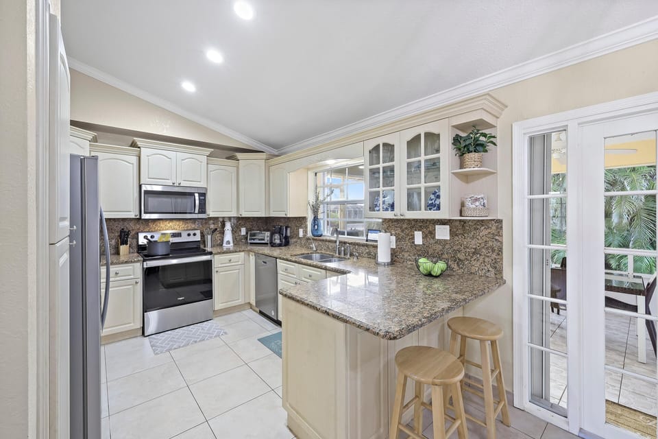 House, Multiple Beds (Pet-friendly waterfront with pool and) | Private kitchen | Fridge, microwave, oven, stovetop