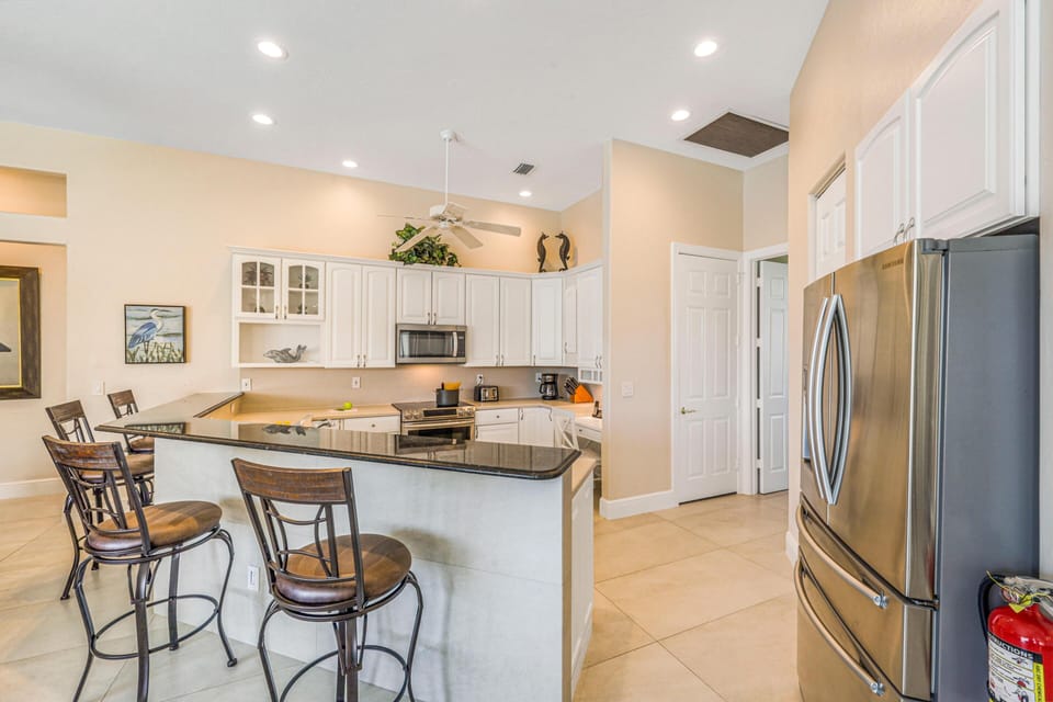 House, Multiple Beds (Waterfront home with pool, spa and wa) | Private kitchen | Fridge, microwave, oven, stovetop