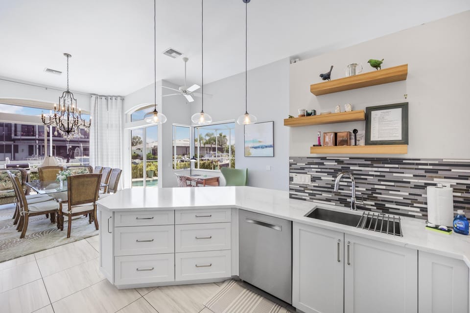House, Multiple Beds (Stylish waterfront home with pool and) | Private kitchen | Fridge, microwave, oven, stovetop