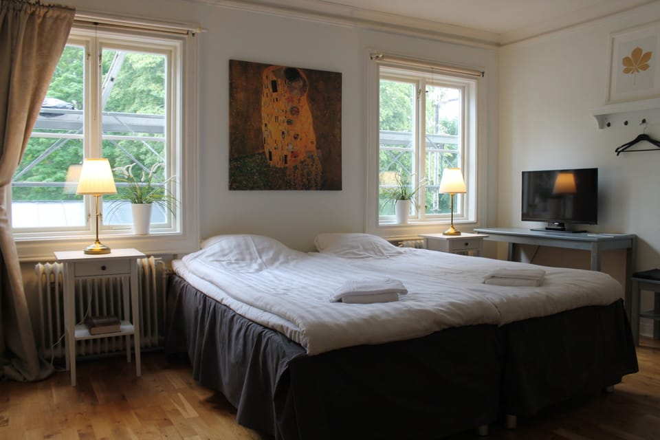 Desk, blackout drapes, iron/ironing board (on request)