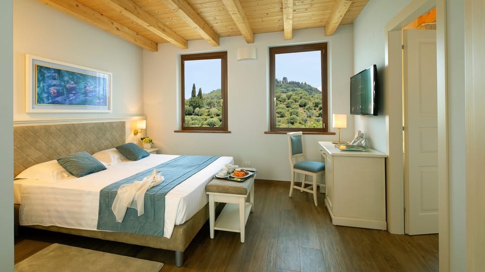 Superior Suite, Hill View | Premium bedding, down comforters, minibar, in-room safe