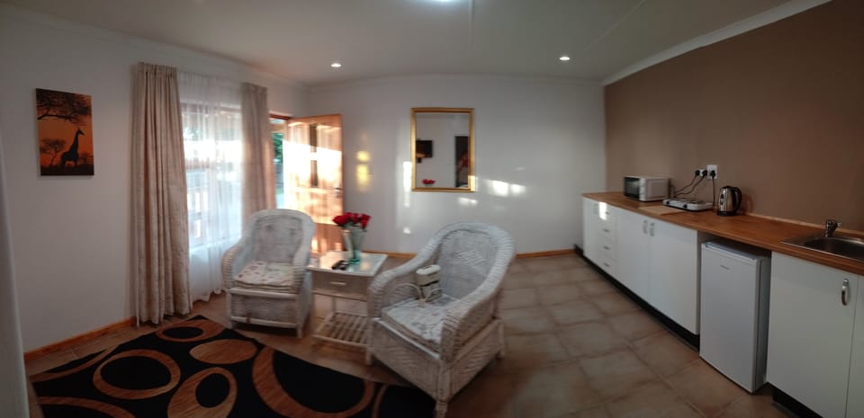 Giraffe suite | Living area | 32-inch Smart TV with satellite channels