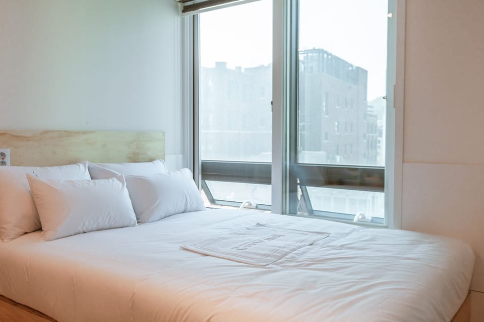 Double Room, City View | Iron/ironing board, free WiFi, bed sheets