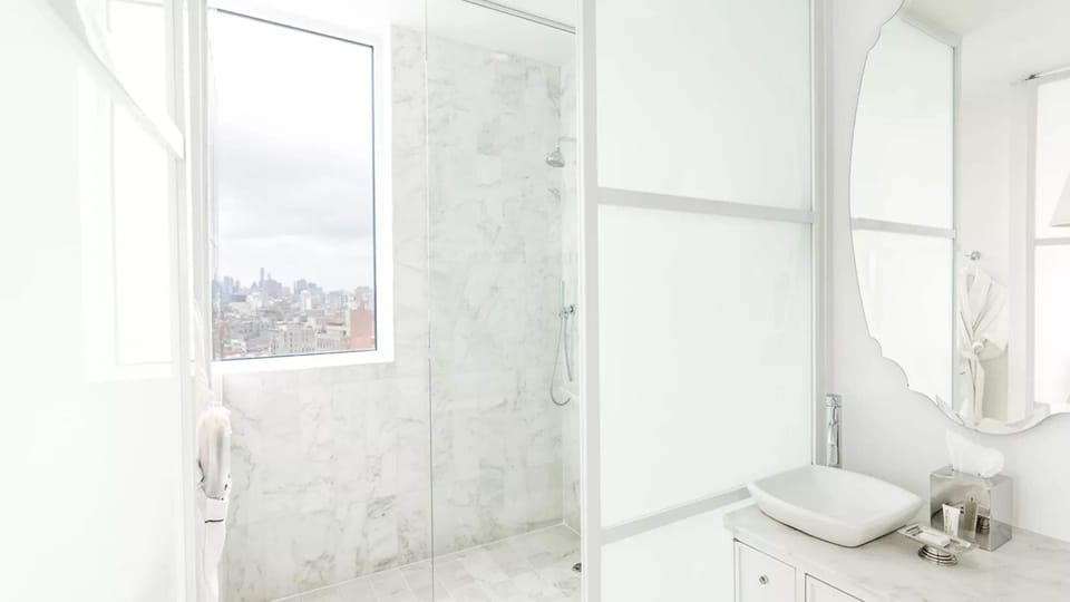 Premium Room, 1 King Bed | Bathroom | Shower, designer toiletries, hair dryer, towels