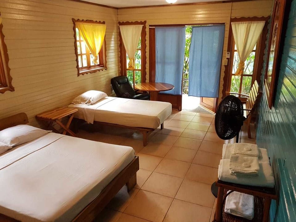 Basic Triple Room, Multiple Beds, Garden Area | Iron/ironing board, free WiFi, bed sheets