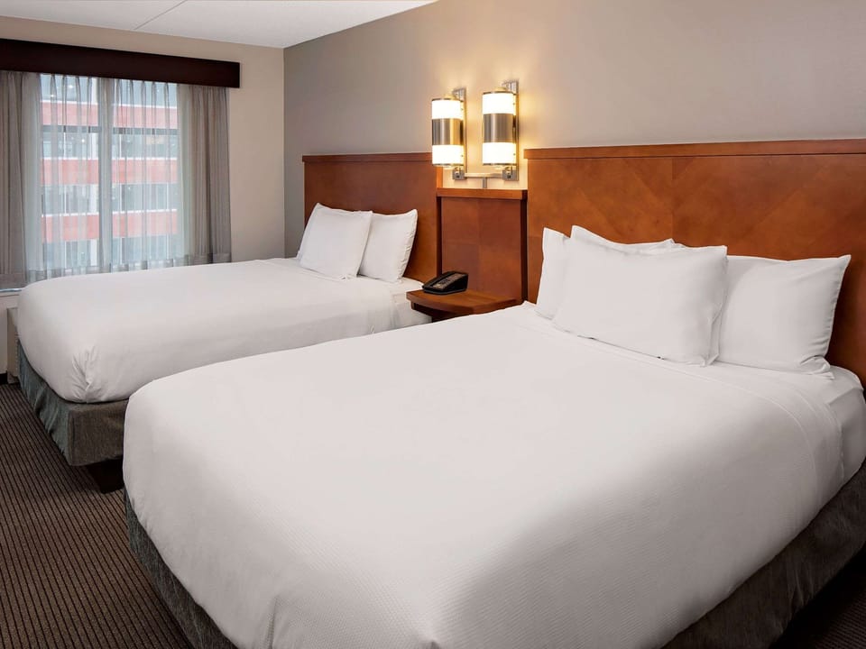 Premium bedding, pillowtop beds, desk, blackout drapes