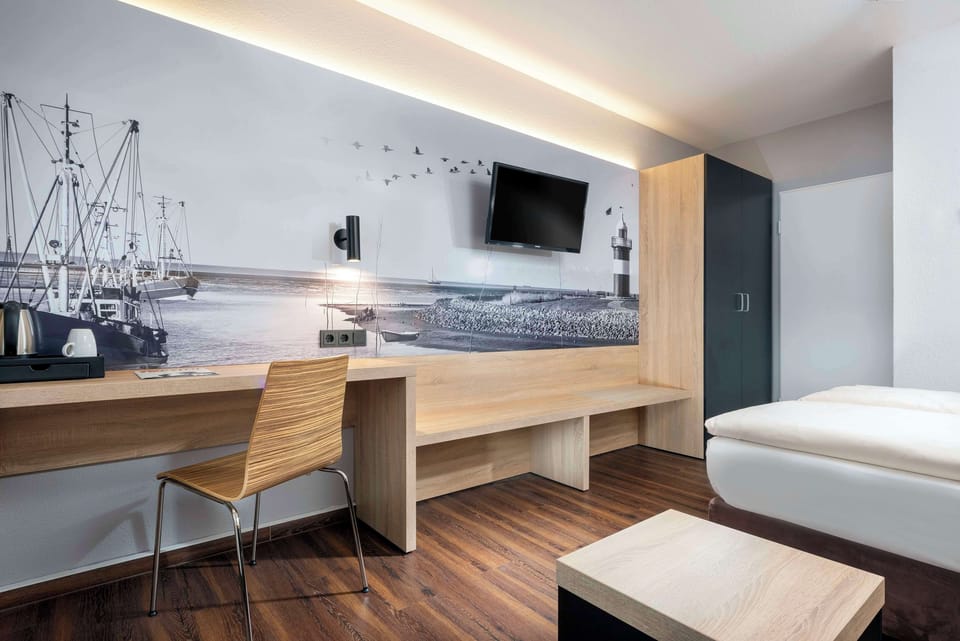 In-room safe, laptop workspace, blackout drapes, soundproofing