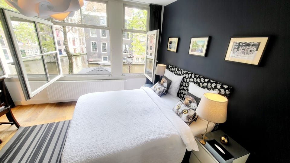 Deluxe Double Room, 1 King Bed, Canal View | In-room safe, individually decorated, desk, blackout drapes