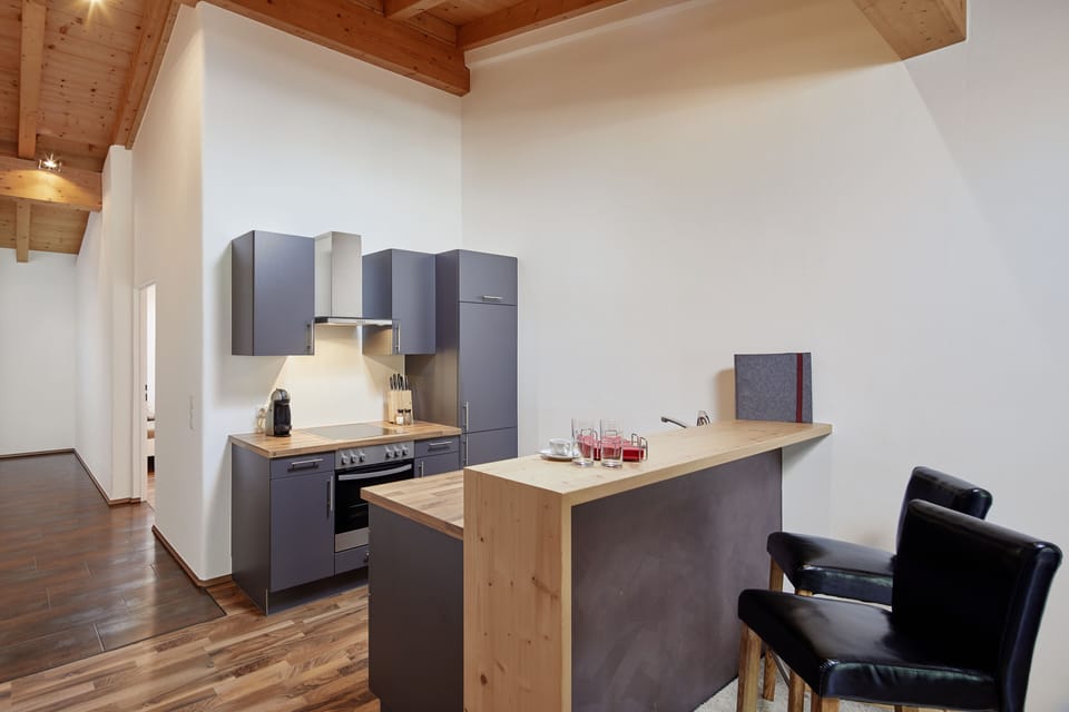 Junior-Apartment, 1 Schlafzimmer, Balkon (incl. 160 EUR cleaning fee) | Living area | 38-inch flat-screen TV with cable channels, LCD TV, heated floors