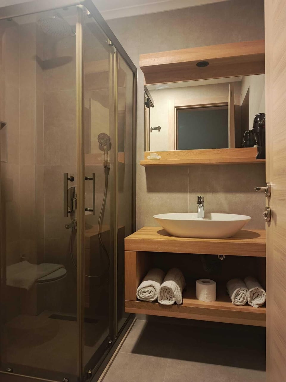 Shower, hair dryer, slippers, towels