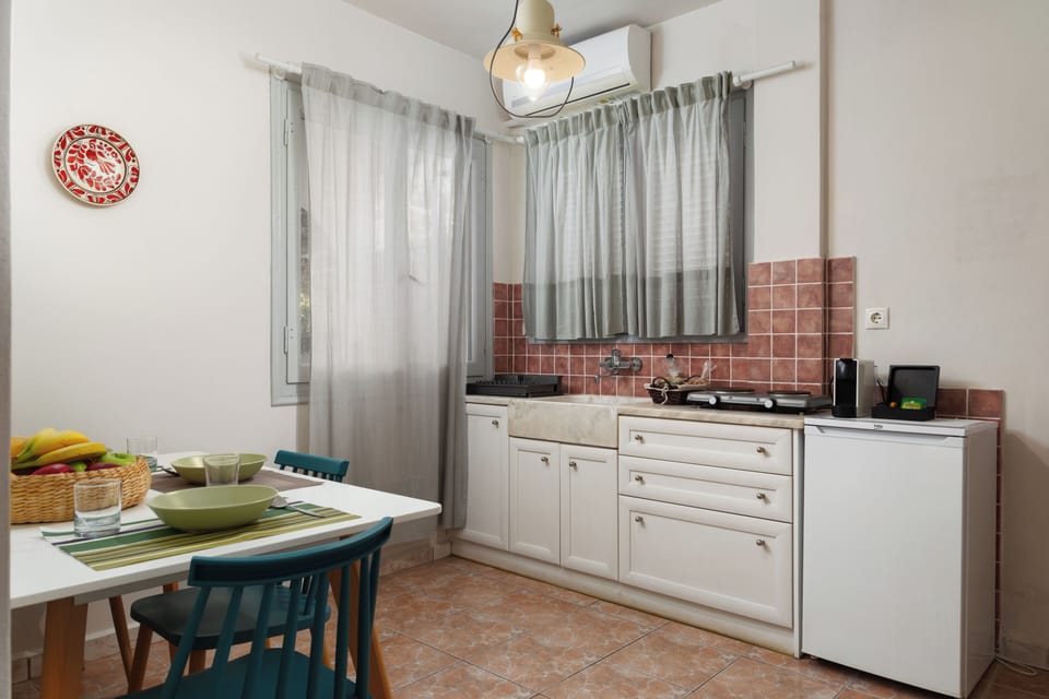 Deluxe Apartment, Courtyard Area (Private Courtyard and Village View) | Private kitchen | Fridge, stovetop, espresso maker, electric kettle
