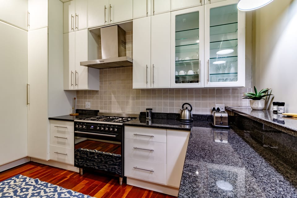 Family Room, 2 Queen Beds, Garden View | Private kitchen | Electric kettle