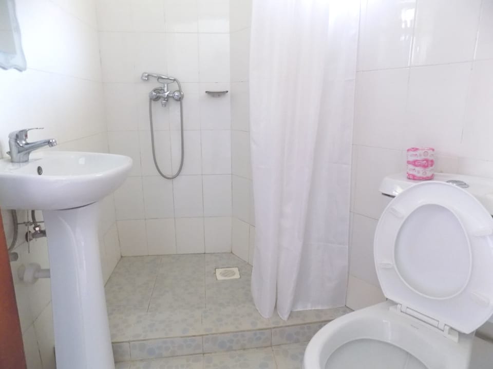 Shower, rainfall showerhead, slippers, towels