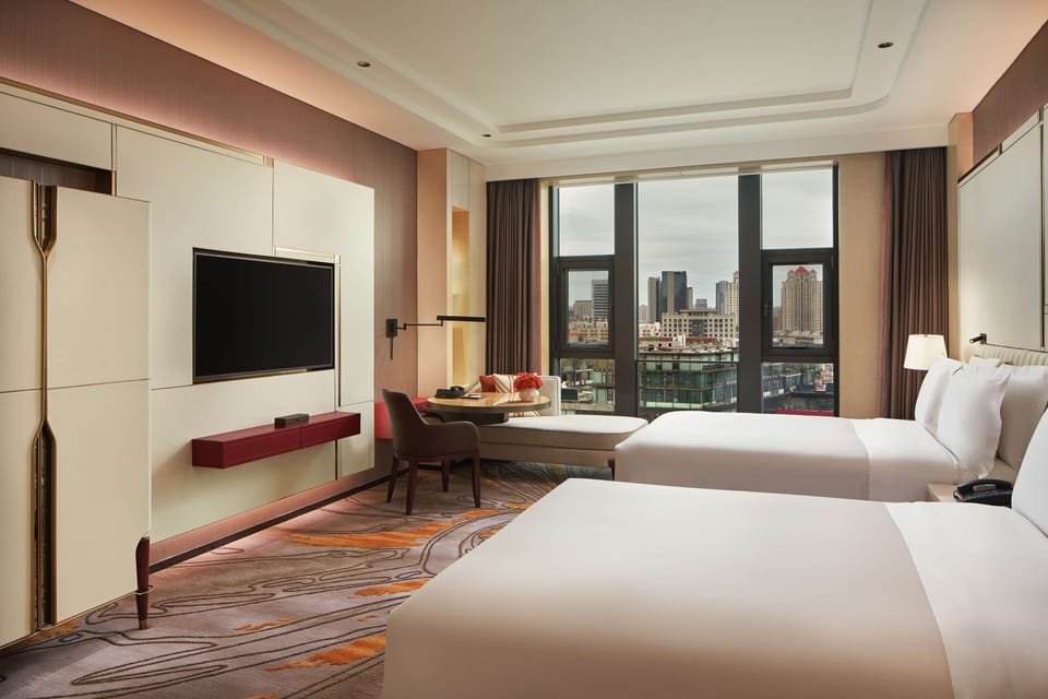 Premium bedding, pillowtop beds, minibar (some free items), in-room safe