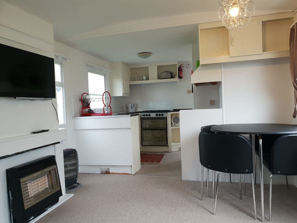 3 Bedroom Static Caravan (Double Glazed, Central Heating) | Living area | Flat-screen TV
