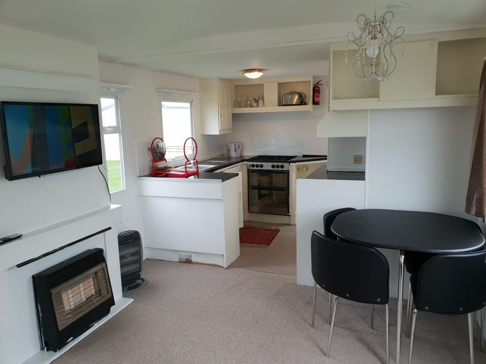 3 Bedroom Static Caravan (Double Glazed, Central Heating) | Living area | Flat-screen TV