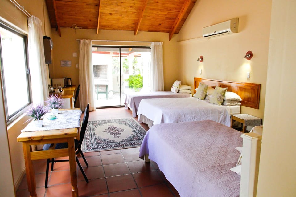 Family Quadruple Room, Multiple Beds, Garden View | 1 bedroom, in-room safe, desk, blackout drapes