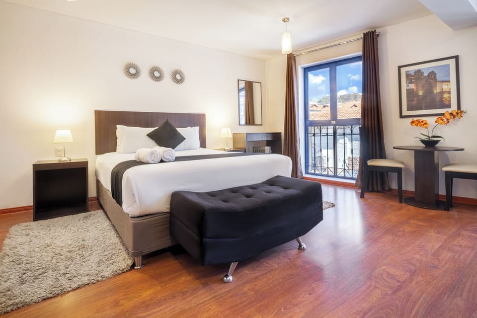 Exclusive Suite (Jacuzzi) | Desk, laptop workspace, blackout drapes, iron/ironing board