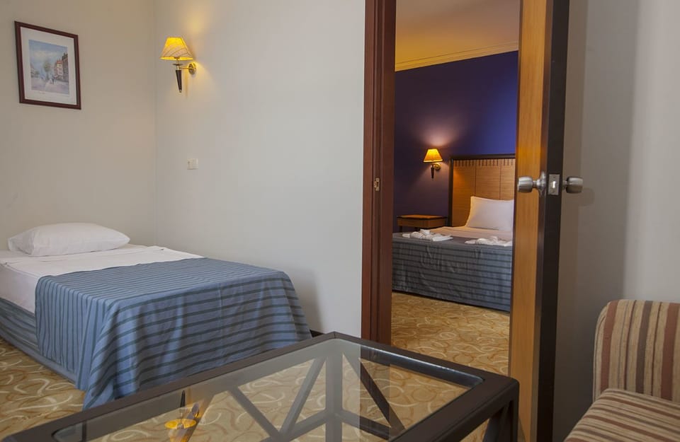 Family Room, 2 Bedrooms, Sea View | Premium bedding, free minibar, in-room safe, iron/ironing board