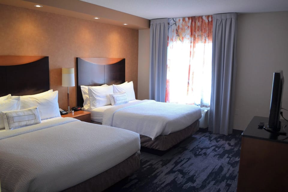 Premium bedding, pillowtop beds, desk, laptop workspace