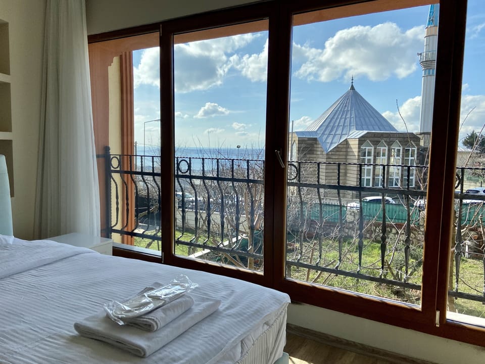Room 5 - Triple Room With Sea View | Desk, laptop workspace, soundproofing, iron/ironing board