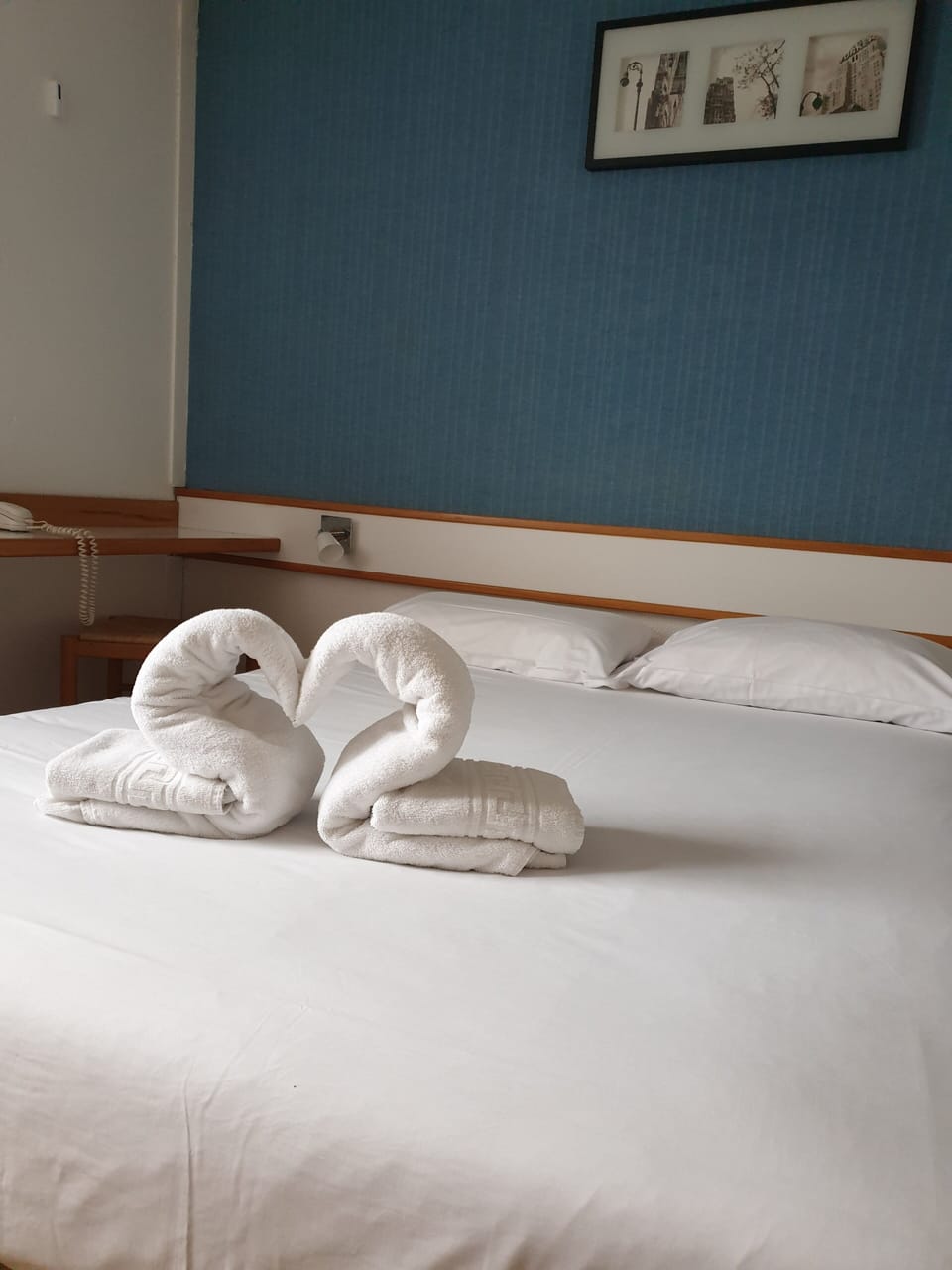 Premium bedding, Tempur-Pedic beds, laptop workspace, blackout drapes