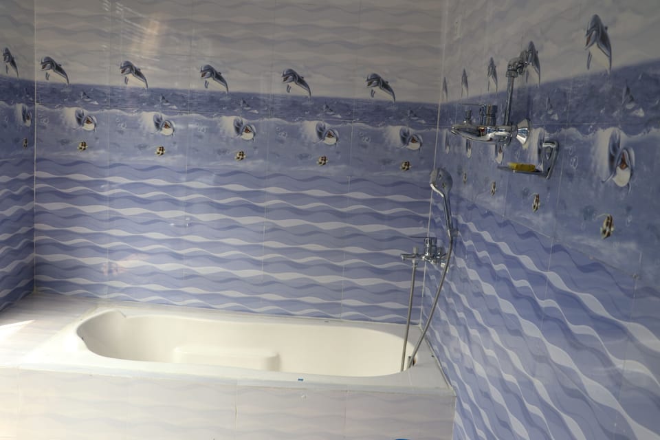 Family Double or Twin Room | Bathroom | Spring water tub, rainfall showerhead, towels, soap