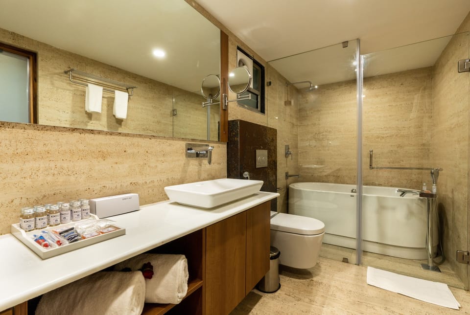 Junior Suite, 1 Double Bed, City View | Bathroom | Shower, rainfall showerhead, free toiletries, hair dryer