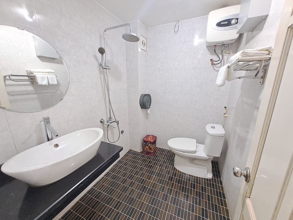 Shower, eco-friendly toiletries, hair dryer, slippers