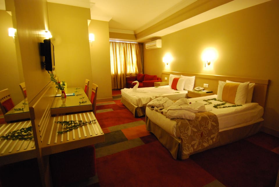 Egyptian cotton sheets, premium bedding, minibar, in-room safe