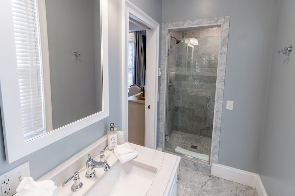 Room 1 | Bathroom | Shower, designer toiletries, hair dryer, towels