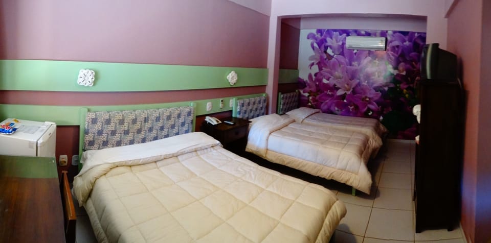 Basic Quadruple Room, Multiple Beds | Minibar, blackout drapes, iron/ironing board, free WiFi