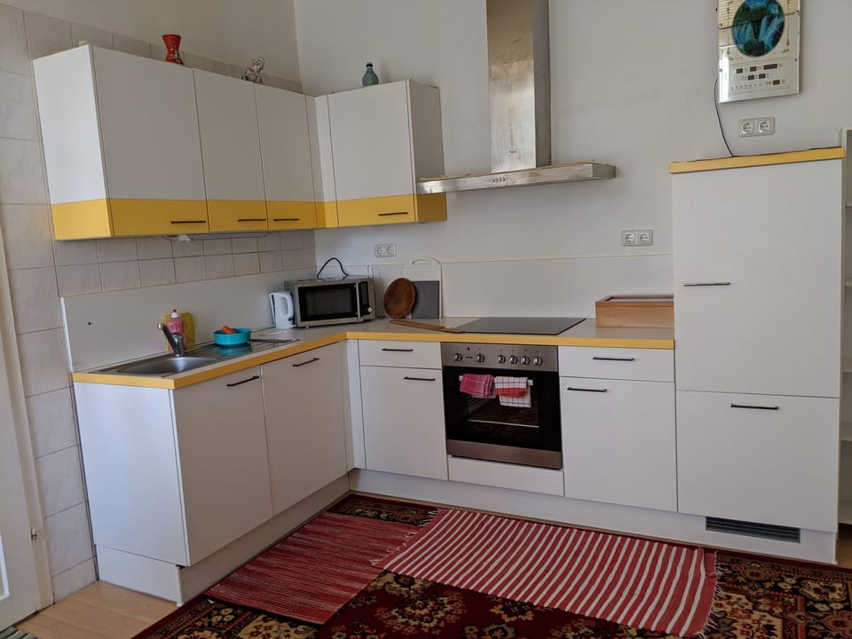 Apartment, Garden View | Private kitchen | Full-size fridge, microwave, oven, stovetop