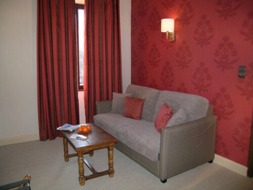 Quadruple Room | Living area | 66-cm flat-screen TV with digital channels